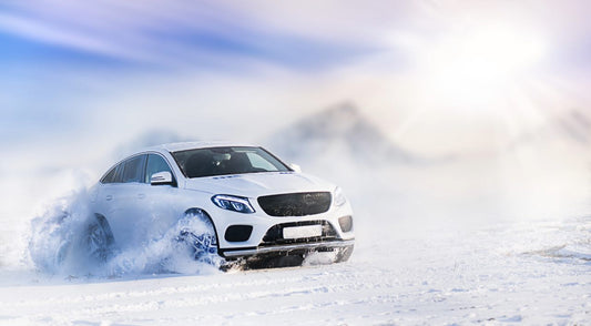 Armadillo Pro Shield hydrophobic marine ceramic sealer protects white SUV in snowy terrain