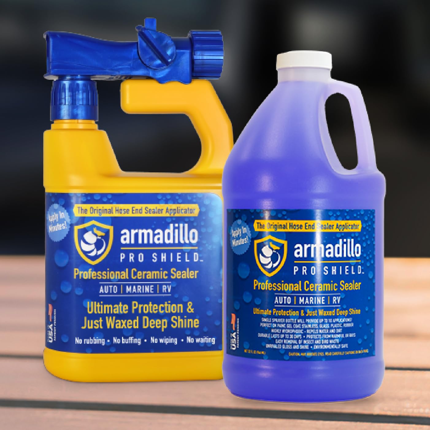 Two bottles of Armadillo Pro Shield Professional Ceramic Sealer on a wooden surface with a dark background.